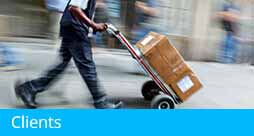 Man pushing handcart making deliveries - Homepage Feature Section - links to Clients & Testimonials page